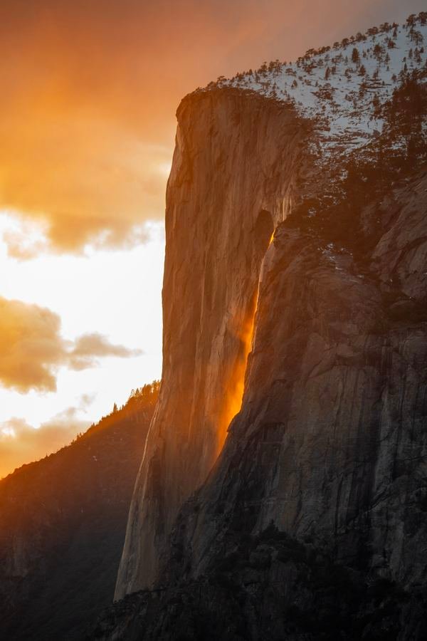 Horsetail Fall glowing orange at sunset on the face of El Capitan